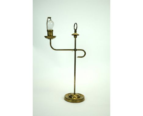 An Edwardian brass students’ lamp with sliding adjustable branch on a weighted circular base (electrified), 68cm high, togeth