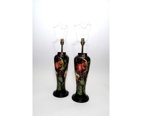 A pair of Moorcroft Queen's Choice lamp bases 20th century, of tall slender form, impressed marks, 23cm high (complete with o