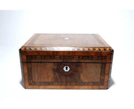 A Victorian parquetry inlaid writing slope, in walnut and mixed veneers, with mother of pearl lock escutcheon and vacant cart