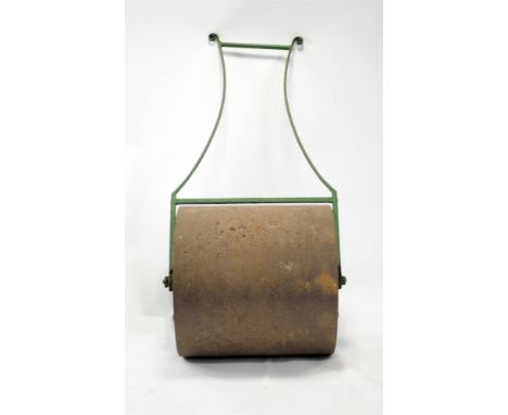 A Victorian Coalbrookdale cast iron country house garden lawn roller, the green painted scrolled handles before a scrolling f