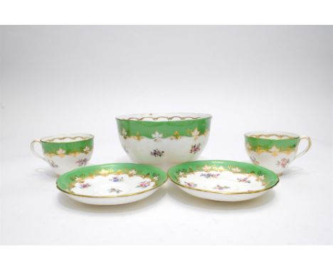 A Victorian part tea and coffee service decorated with apple green borders and flowers comprising nineteen coffee and teacups