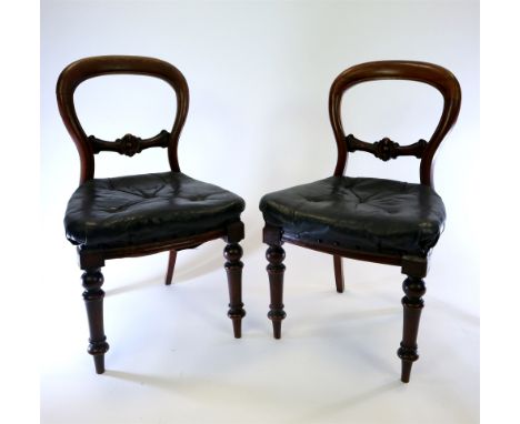 A harlequin set of six Victorian mahogany balloon back dining chairs comprising three with plain hoop backs and three with in