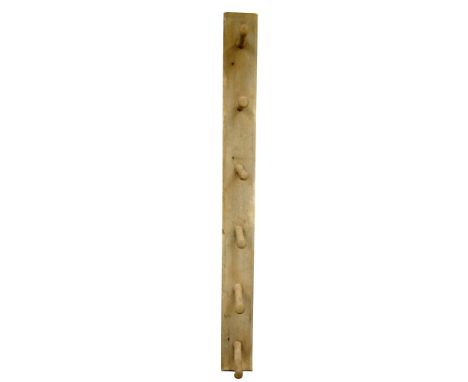 An old country pine wall hanging cloak/linen rack of simple construction, the back board with canted corners accommodating si