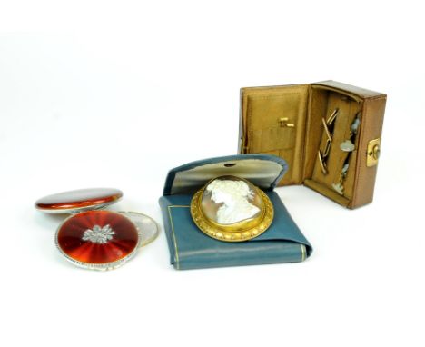 An oval shell cameo brooch with yellow metal decorative mount, presented in Hennell pouch, together with a silver, marcasite 