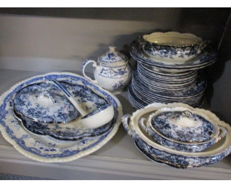 A selection of blue and white dinnerware to include a ladle, teapot and other items 
