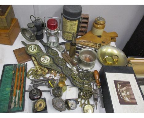 A mixed lot to include horse brasses, compass, trench art, fire bellows, bike lamps and other items 