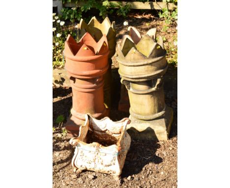 FOUR VARIOUS CHIMNEY POTS, average height 75cm, comprising three circular and one squared, together with a cast iron white pa