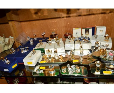 A LARGE COLLECTION OF SWARVOSKI CRYSTAL MEMORIES, to include Saxophone and stand (boxed), Birthday Cake and tray (boxed), rol