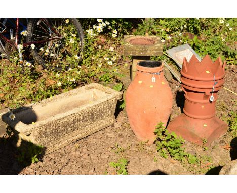 A TERRACOTTA CHIMNEY POT, diameter 31cm x height 62cm, together with a terracotta urn, composite trough, width 34cm x length 