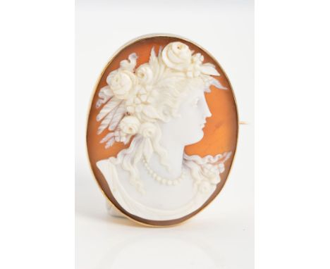 A MID 20TH CENTURY CAMEO BROOCH, oval measuring approximately 42mm x 33mm, a shell cameo depicting a maiden in portrait, stam