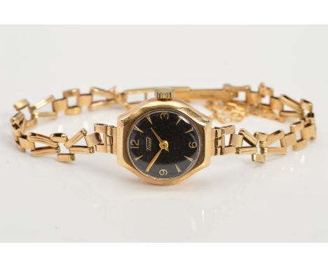 A LADY'S 9CT GOLD TISSOT WRIST WATCH, designed with a circular black face, Arabic numerals and baton hour markers, a brick li
