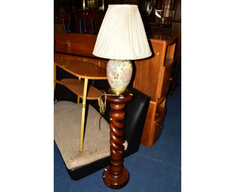 A STAINED HARDWOOD TORCHERE STAND together with a ceramic table lamp and two prints (4)