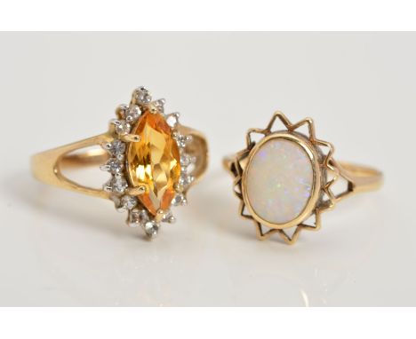 TWO 9CT GOLD GEM DRESS RINGS, the first claw set with a central marquise shape citrine within a pale blue circular gem surrou