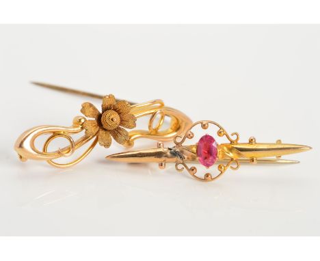 TWO EARLY 20TH CENTURY GOLD BROOCHES, the first an tapered bar set with a central marquise shape pink paste within an open sc