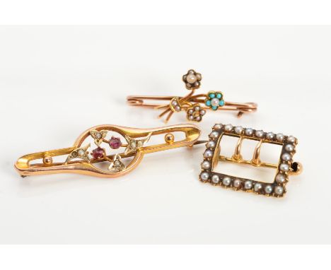 THREE EARLY 20TH CENTURY GOLD BROOCHES, the first designed as a belt buckle set with split pearls, the second a bar brooch ov