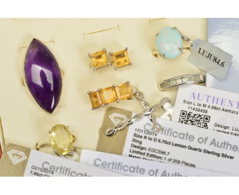 SEVEN ITEMS OF GEM JEWELLERY, to include an Ethiopian opal cabochon ring, a large marquise shape amethyst ring, an oval quart