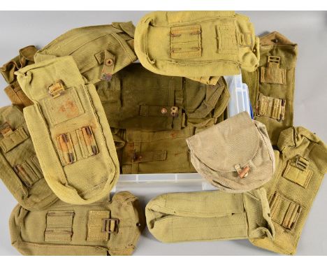 A PLASTIC BOX CONTAINING TWENTY THREE ITEMS OF MILITARY WEBBING IN THE FORM OF AMMO POUCHES, small item carry cases, etc, mai