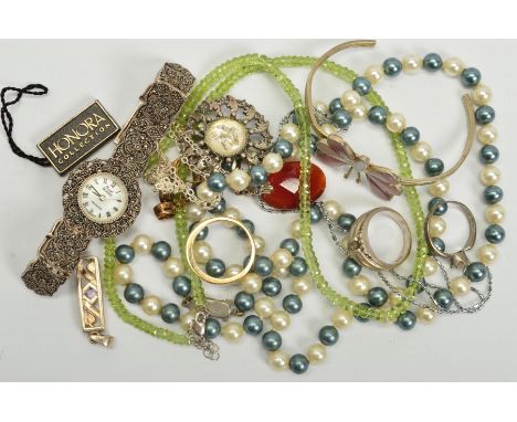 A SELECTION OF JEWELLERY, to include a marcasite wrist watch, an imitation pearl necklace, a torque bangle with a central but