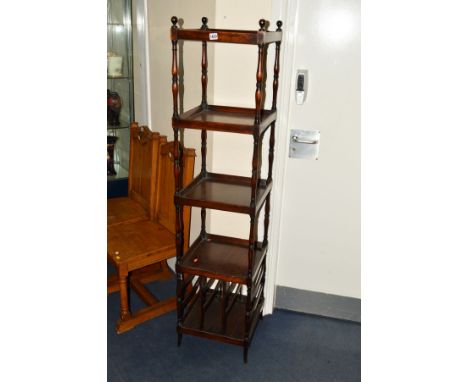 AN EDWARDIAN MAHOGANY FOUR TIER WHAT NOT of a square proportions, lipped edge to each shelf above a bottom shelf with double 