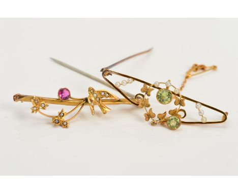 TWO EARLY 20TH CENTURY GOLD BROOCHES, a seed pearl and peridot foliate design, stamped '15c' and a similar garnet and seed pe