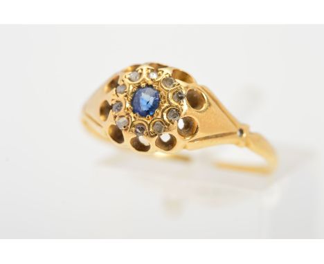 A LATE VICTORIAN 18CT GOLD SAPPHIRE AND DIAMOND RING, the central circular blue sapphire within a single cut, rose cut and ro