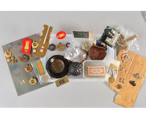 A PLASTIC BOX CONTAINING A VARIETY OF MILITARIA ITEMS, as follows, WWI Grenade (possible German Krugel style), a number of Br