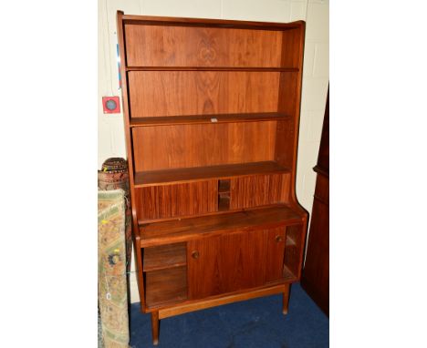 BORGE MOGENSEN, a Danish teak secretaire bookcase, the double open adjustable shelves above tambour front revealing two drawe