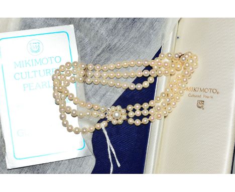 A THREE ROW CULTURED PEARL CHOKER NECKLACE with 9ct gold clasp, designed as three rows of uniform pearls with two bar spacers