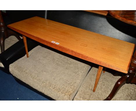 GORDON RUSSELL, BROADWAY WORKS, a teak coffee table, with shaped sides on four square tapering legs, maker's label stamped to