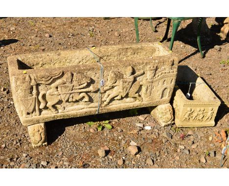 A COMPOSITE TROUGH DETAILING A BATTLE SCENE on seperate lion feet, height 42cm x length 90cm x width 27cm
