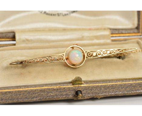 AN OPAL BROOCH, designed as an elongated tapered panel with scrolling openwork decoration and central circular opal cabochon,