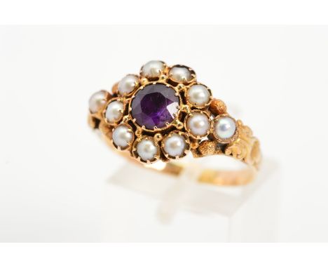 A LATE VICTORIAN GOLD AMETHYST AND SPLIT PEARL RING, the central circular amethyst  within a split pearl, textured bead and s