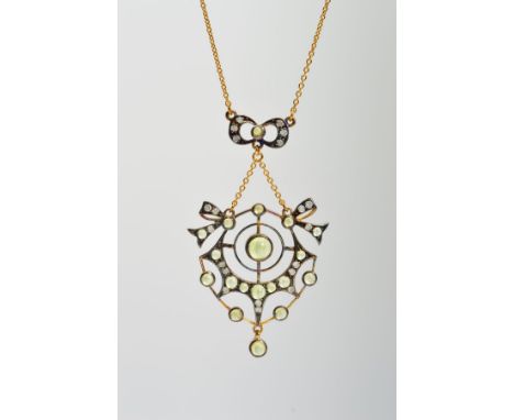 A PERIDOT AND DIAMOND PENDANT, of openwork design set with circular peridot cabochons and brilliant cut diamonds, suspended f