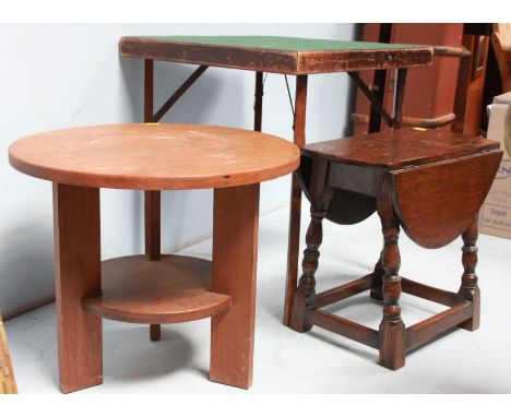 A circular, two tier occasional table in the style of Gustav Stickley, together with another circular coffee table and a fold