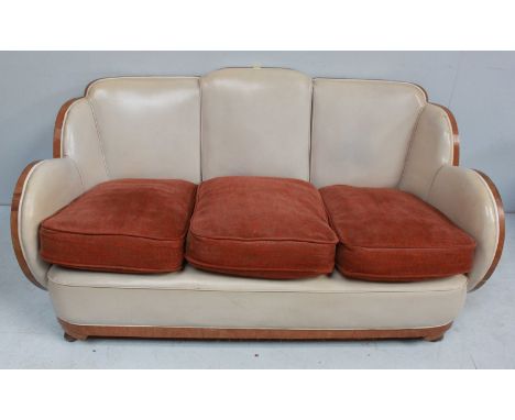 An Art Deco Epstein walnut three piece cloud suite, comprising a sofa and two tub chairs, with cream leather upholstery and s