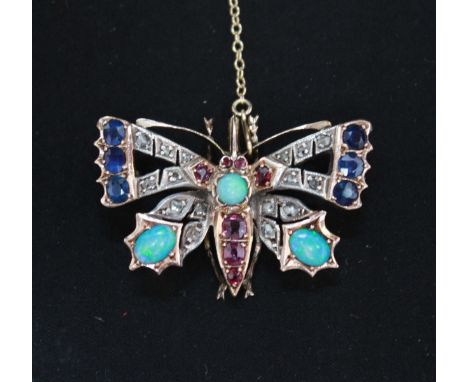 A diamond, sapphire, ruby and opal butterfly brooch, set in unmarked yellow gold.