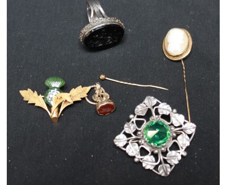 A gold and jade brooch; a silver Art Nouveau style brooch; a gilt metal seal; an unusual 19th century seal ring, and a yellow