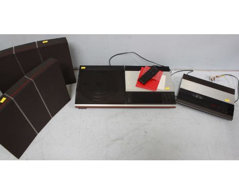 A Bang & Olufsen stereo sound system, comprising: A Bencenter 7007 turntable and cassette player, a Beogram CDX2 CD player an