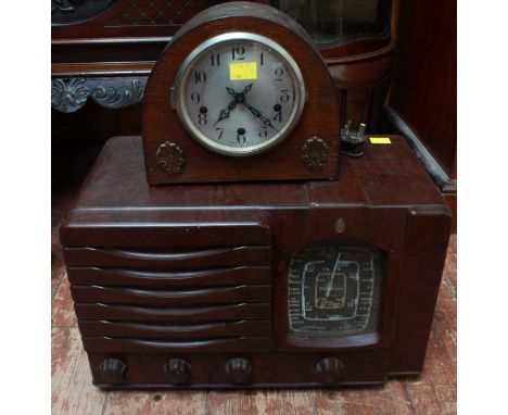 A Smiths oak cased mantle clock and a Bakelite radio (2).