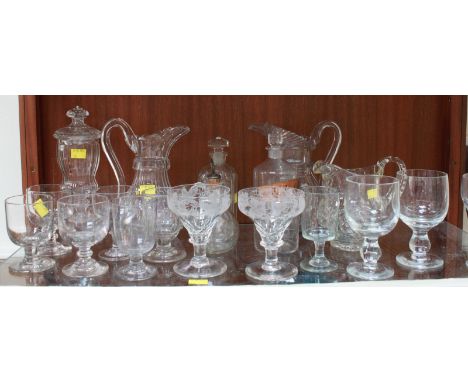 A shelf lot of assorted good quality glassware, mostly 18th and 19th century, including jugs, decanters, rummers and other gl