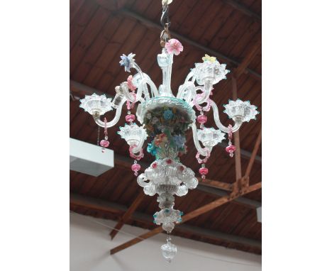 A Venetian coloured and clear glass hanging six-light chandelier, with applied coloured glass flowers, in the style of Giusep