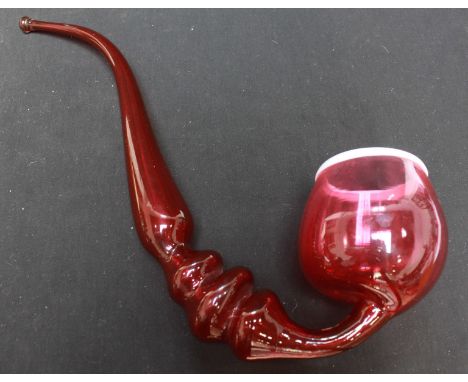 A large Victorian cranberry glass pipe.
