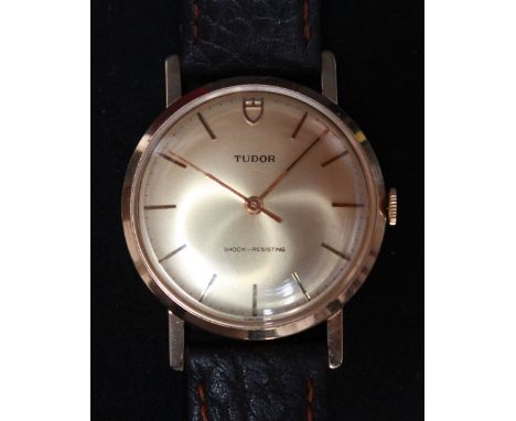 A Gentleman's 9ct gold Tudor Rolex wristwatch, the gilded dial with baton numerals and with 17 ruby mechanical movement on a 