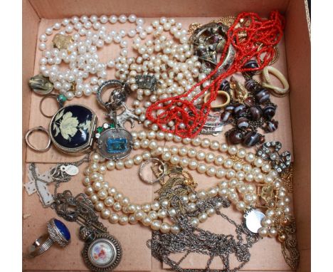 A collection of assorted costume jewellery including faux pearl necklaces, silver brooches and other items.