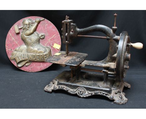 A Victorian Wanzer manual sewing machine and a cast brass plaque 'Thunderer' (2).