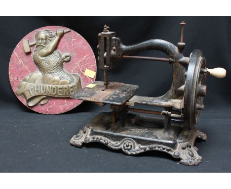 A Victorian Wanzer manual sewing machine and a cast brass plaque 'Thunderer' (2).