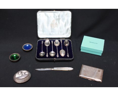 A collection of silver objects including an engine turned cigarette case, a Continental pill box, a pair of enamel salts, a m