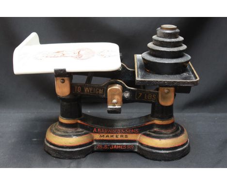 A set of Victorian cast iron weighing scales made by Barwood & Sons of Southsea, together with a graduated set of weights.