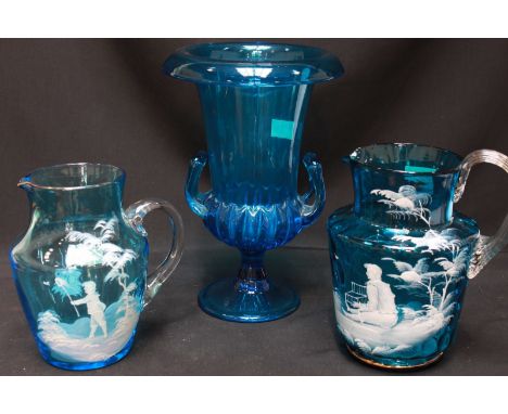 Two Victorian Mary Gregory enamel painted turquoise glass jugs and a large campagna urn shaped vase 26.5cm high (3).