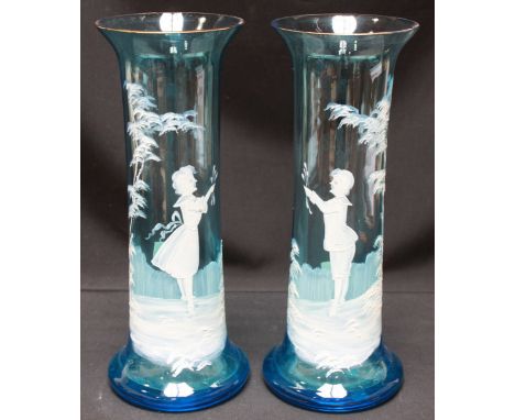 A pair of Victorian Mary Gregory enamel painted turquoise glass vases, of cylindrical form. 28 cm high.